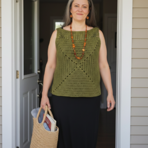 Handmade crochet granny square tank top formed from a single uninterrupted square pattern, centered design radiating outward, finished with mesh shoulder accents for added detail and airflow.