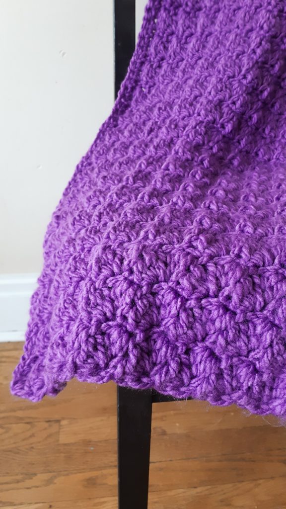 up close texture of chunky crochet blanket